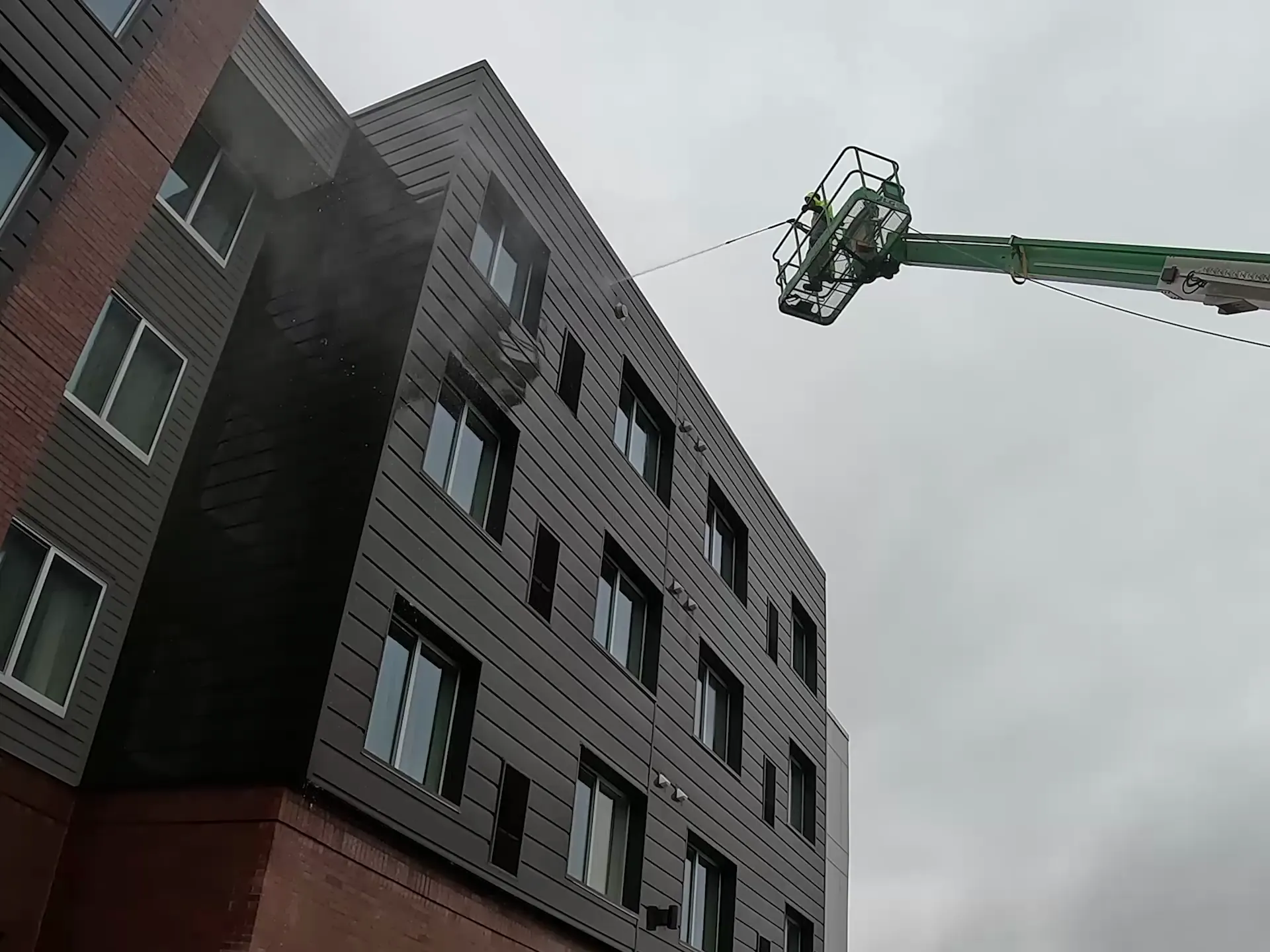 Soft washing a commercial building exterior