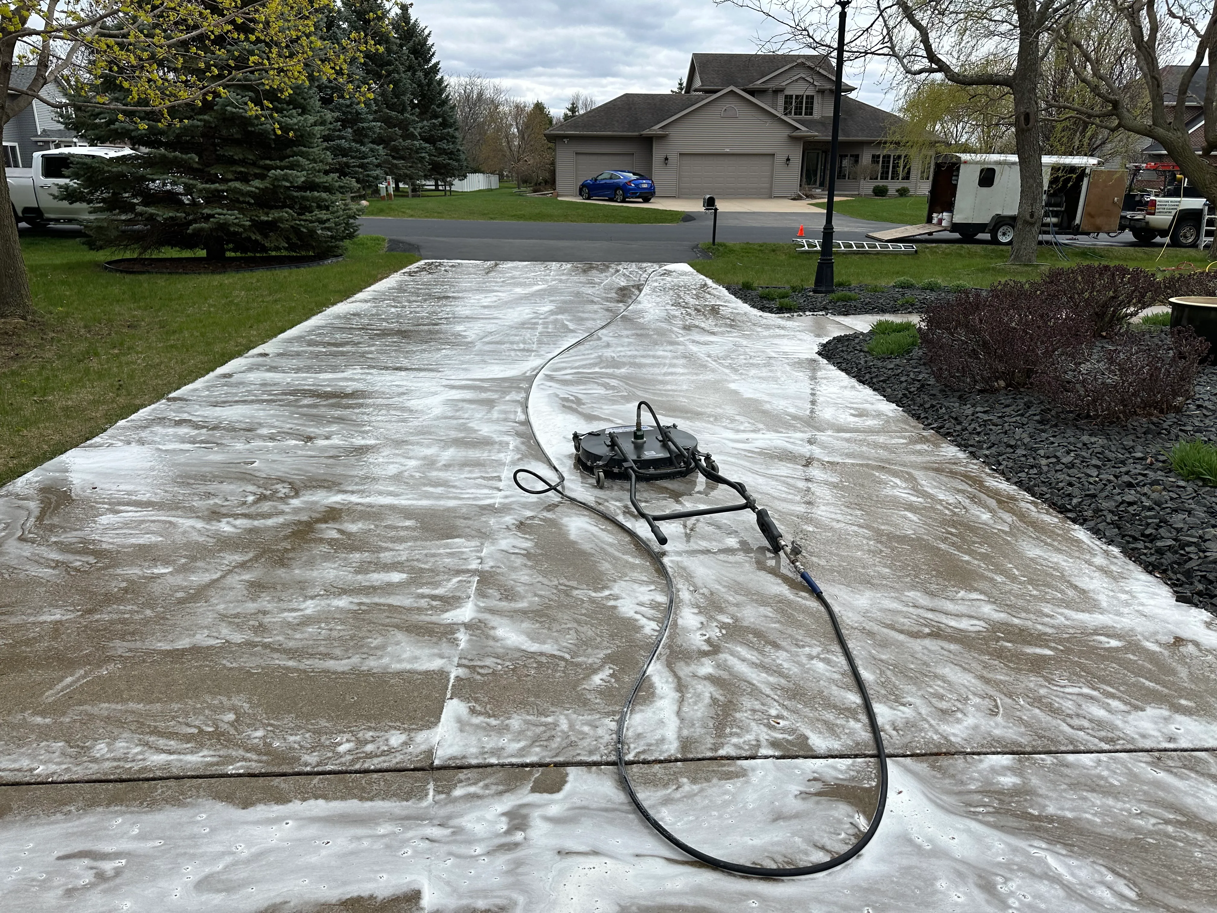 Before and after concrete and driveway pressure washing