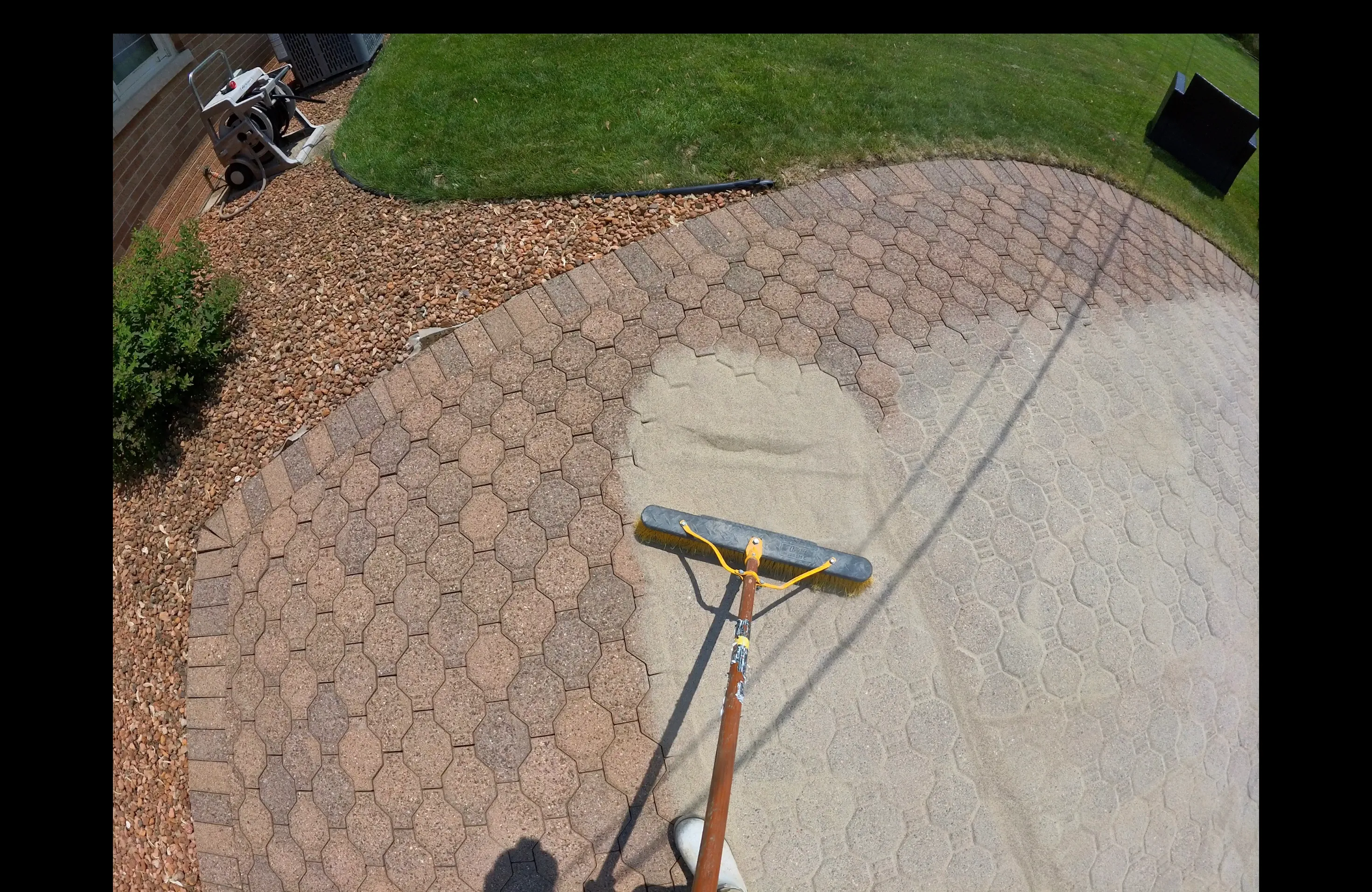 Polymeric sand application for pavers